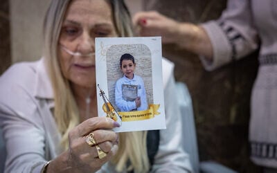 Family members of seven-year-old Hillel Mordechai Dadon, who was allegedly murdered by his neighbor, 26-year-old Liel Ifergan, hold up his picture as prosecutors filed murder charges at the Jerusalem District Court, September 14, 2026. (Yonatan Sindel/Flash90) Family members of seven-year-old Hillel Mordechai Dadon, who was allegedly murdered by his neighbor, 26-year-old Liel Ifergan, hold up his picture as prosecutors filed murder charges at the Jerusalem District Court, September 14, 2026. (Yonatan Sindel/Flash90)