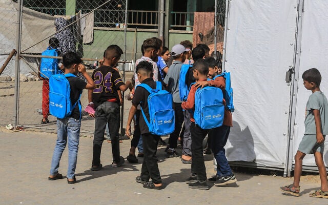 Palestinian students attend the first day of the new school year in Khan Yunis, in the southern Gaza Strip, wearing blue UNICEF backpacks, September 19, 2026. (Abed Rahim Khatib/Flash90)