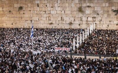 People attend the final Selichot prayers before Yom Kippur at the Western Wall in Jerusalem’s Old City, early on September 20, 2026. (Chaim Goldberg/Flash90) People attend the final Selichot prayers before Yom Kippur at the Western Wall in Jerusalem’s Old City, early on September 20, 2026. (Chaim Goldberg/Flash90)
