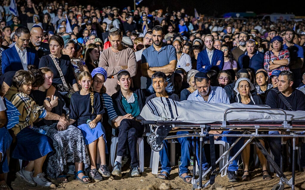 Family and friends attend the funeral of Netanel Shukrun, who was killed in a terror shooting attack at a spring near Neve Tzuf in the West Bank, at the cemetery in his community of Alei Zahav, September 21, 2026. (Hilel Ben Or/Flash90)