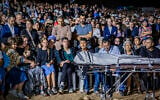 Family and friends attend the funeral of Netanel Shukrun, who was killed in a terror shooting attack at a spring near Neve Tzuf in the West Bank, at the cemetery in his community of Alei Zahav, September 21, 2026. (Hilel Ben Or/Flash90)