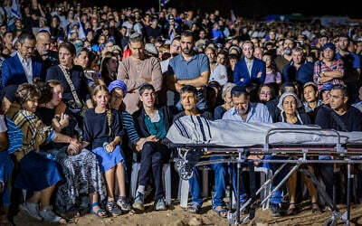 Family and friends attend the funeral of Netanel Shukrun, who was killed in a terror shooting attack at a spring near Neve Tzuf in the West Bank, at the cemetery in his community of Alei Zahav, September 21, 2026. (Hilel Ben Or/Flash90)