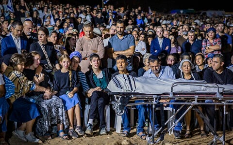 Family and friends attend the funeral of Netanel Shukrun, who was killed in a terror shooting attack at a spring near Neve Tzuf in the West Bank, at the cemetery in his community of Alei Zahav, September 21, 2026. (Hilel Ben Or/Flash90)