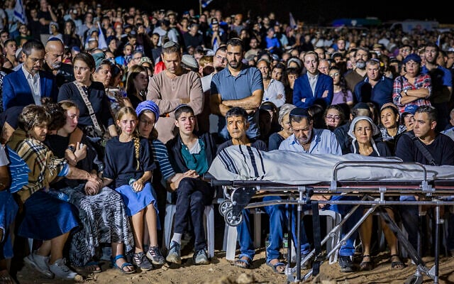 Family and friends attend the funeral of Netanel Shukrun, who was killed in a terror shooting attack at a spring near Neve Tzuf in the West Bank, at the cemetery in his community of Alei Zahav, September 21, 2026. (Hilel Ben Or/Flash90)
