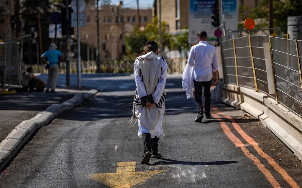 People walk on empty streets in Jerusalem on Yom Kippur, the holiest day in the Jewish calendar, September 21, 2026. (Yonatan Sindel/Flash90) People walk on empty streets in Jerusalem on Yom Kippur, the holiest day in the Jewish calendar, September 21, 2026. (Yonatan Sindel/Flash90)