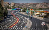 An ambulance drives at the entrance to Jerusalem on Yom Kippur, the holiest day in the Jewish calendar, September 21, 2026. (Yonatan Sindel/Flash90)