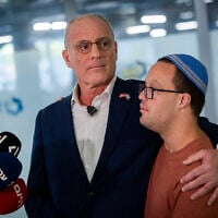 Israeli Ambassador to the United States Yechiel Leiter gives a statement to the media at Shaare Zedek Medical Center in Jerusalem, after his son Neria, an IDF reservist, was hospitalized in critical condition after being seriously wounded in a car-ramming attack the previous day, September 24, 2026. At right is Leiter's son Noam. (Chaim Goldberg/Flash90)