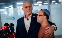 Israeli Ambassador to the United States Yechiel Leiter gives a statement to the media at Shaare Zedek Medical Center in Jerusalem, after his son Neria, an IDF reservist, was hospitalized in critical condition after being seriously wounded in a car-ramming attack the previous day, September 24, 2026. At right is Leiter's son Noam. (Chaim Goldberg/Flash90)