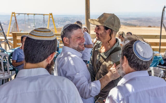 Finance Minister Bezalel Smotrich visits Meir La’aretz Farm, a settlement in the West Bank, during the holiday of Sukkot, as part of his election campaign, September 27, 2026. (Hilel Ben Or/Flash90)