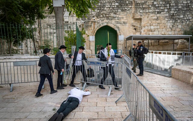 Jewish men pray and dance at the entrance to the Temple Mount in Jerusalem’s Old City on September 29, 2026. (Chaim Goldberg/Flash90)