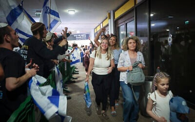 Passengers from flydubai flight FZ1073 walk with their family members after they were saved from an alleged attempt to crash their plane, at Ben Gurion Airport, September 30, 2026. (Jamal Awad/Flash90) Passengers from flydubai flight FZ1073 walk with their family members after they were saved from an alleged attempt to crash their plane, at Ben Gurion Airport, September 30, 2026. (Jamal Awad/Flash90)