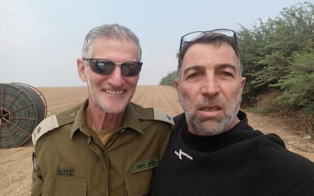 Yair Golan (left), with Gaza border farmer Oz Davidian (right), in an image showing Golan going to rescue survivors near the Gaza border soon after the Hamas invasion on October 7, 2023. (Courtesy)