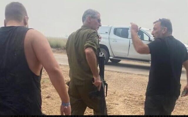 Yair Golan (left), with Gaza border farmer Oz Davidian (right), in an image showing Golan going to rescue survivors near the Gaza border soon after the Hamas invasion on October 7, 2023. (Courtesy)
