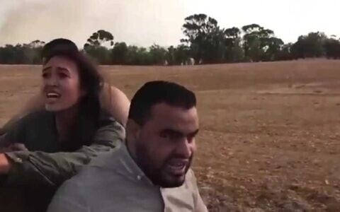 Footage showing Saher Nidal Saqr (right) kidnapping Noa Argamani during the October 7, 2023, onslaught. (Israel Defense Forces)