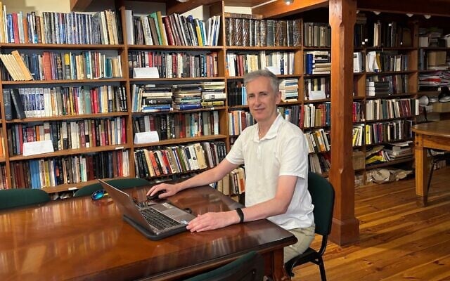 Sergii Gurbych sits at his computer in the Center for East European Jewish History at Vilnius University. (Shira Li Bartov/ JTA)