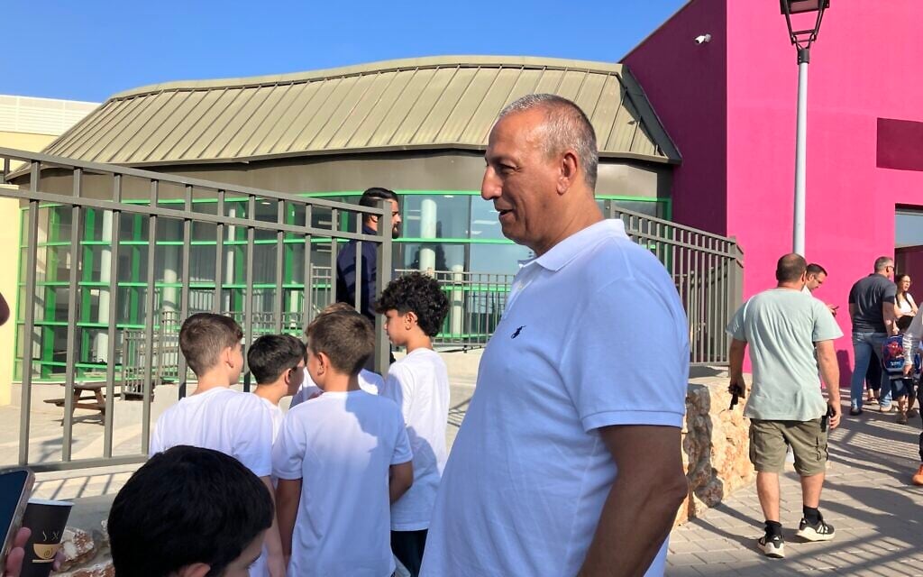 Metula Mayor David Azoulay greets students at Hanadiv Elementary School on September 1, 2026 (Diana Bletter/Times of Israel)