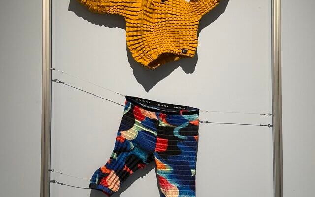 Pleated clothes made from recycled plastic bottle material that grow with the child, at The Circle, the new exhibition at the Holon Design Museum, September 9, 2026. (Sue Surkes/Times of Israel) Pleated clothes made from recycled plastic bottle material that grow with the child, at The Circle, the new exhibition at the Holon Design Museum, September 9, 2026. (Sue Surkes/Times of Israel)