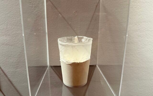 A single use 'paper' cup shown with its thin layer of plastic inside, at The Circle, the new exhibition at the Holon Design Museum, central Israel, September 9, 2026. (Sue Surkes/Times of Israel) A single use 'paper' cup shown with its thin layer of plastic inside, at The Circle, the new exhibition at the Holon Design Museum, central Israel, September 9, 2026. (Sue Surkes/Times of Israel)