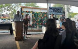 Jon and Rachel Goldberg-Polin speak at a dedication ceremony for a community fridge in memory of their son Hersh in Skokie, Illinois, on September 2, 2026. (Times of Israel staff)