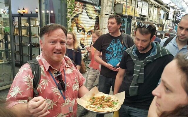 Joel Haber guiding in Jerusalem’s Machane Yehuda market, 2026. (Courtesy)
