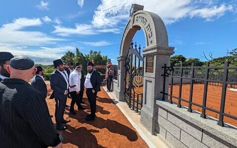 Chabad rabbis stand outside the new Jewish cemetery in Taiwan, August 31, 2026 (Chabad)