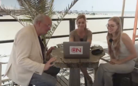 Ongehoord Nederland's then-Editor-in-Chief Joost Niemoller, left, watches a speech by Adolf Hitler, alongside host Arlette Adriani, center, and pundit Raisa Blommenstijn in a segment published by the right-wing Dutch network on July 31, 2026. (Screenshot: Ongehoord Nederland via X)