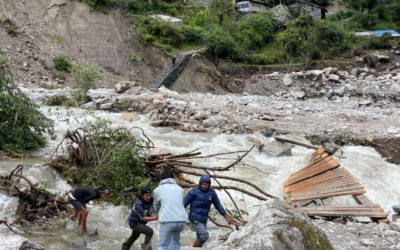 Nepali men stand amid the damage caused by landslides and flooding in the mountain village of Samagaun, where dozens of Israeli tourists were trapped, September 27, 2026. (Courtesy of Passportcard) Nepali men stand amid the damage caused by landslides and flooding in the mountain village of Samagaun, where dozens of Israeli tourists were trapped, September 27, 2026. (Courtesy of Passportcard)