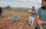 A man lies on the ground after he was shot in the leg by an IDF soldier on the outskirts of the Palestinian village of Faqoua, near Jenin, September 12, 2026 (Screen grab/used in accordance with Clause 27a of the Copyright Law)
