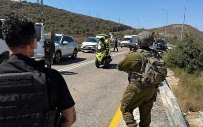 Israeli security and medical forces are seen at the scene of a shooting attack near the West Bank settlement of Neve Tzuf, also known as Halamish, September 20, 2026. (Magen David Adom) Israeli security and medical forces are seen at the scene of a shooting attack near the West Bank settlement of Neve Tzuf, also known as Halamish, September 20, 2026. (Magen David Adom)
