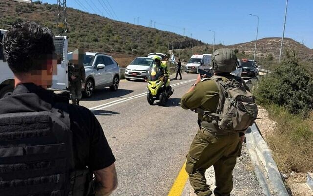 Israeli security and medical forces are seen at the scene of a shooting attack near the West Bank settlement of Neve Tzuf, also known as Halamish, September 20, 2026. (Magen David Adom)