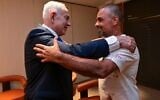 Prime Minister Benjamin Netanyahu meets with one of the Israelis who helped subdue a flydubai copilot who allegedly sought to hijack and crash a plane full of Israelis, on the passengers' return to Ben Gurion Airport on September 30, 2026. (Kobi Gideon/GPO)