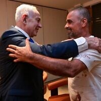 Prime Minister Benjamin Netanyahu meets with Yaniv Harun, one of the Israelis who helped subdue a flydubai copilot who allegedly sought to hijack and crash a plane full of Israelis, on the passengers' return to Ben Gurion Airport on September 30, 2026. (Kobi Gideon/GPO)