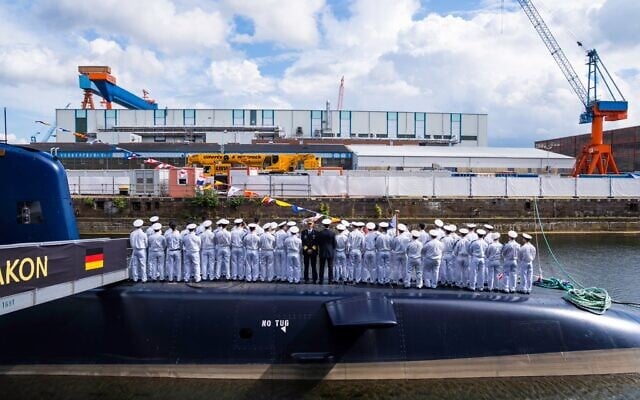 Israeli Navy sailors are seen on top of INS Drakon at Kiel shipyard in Germany, in a handout photo published September 1, 2026. (Israel Defense Forces)