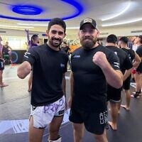 Yehonatan Maatuf, left, who was injured in the Israel-Hamas war in Gaza on April 11, 2025, about to train with Sagi Dovev at the House of Heroes in Or Yehuda on September 9, 2026. (Matan Siegel/Times of Israel)