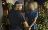 Yaqoub Shibli (right) being arrested by police on August 16 for allegedly pledging allegiance to ISIS. (Screenshot/Israel Police)