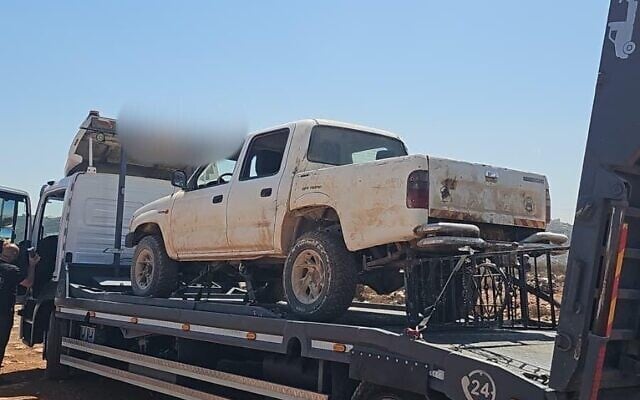 Police tow a white pick-up truck allegedly used in a settler attack on the northern West Bank town of Qusra, in the nearby illegal outpost of Mevasser Hashalom, on September 2, 2026. (Israel Police)