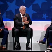 Rep. Mike Collins, a Georgia Republican (C), speaks with RJC National Chairman Senator Norm Coleman (R) on the stage of the Republican Jewish Coalition’s annual convention in Las Vegas, August 31, 2026. (RJC/X)