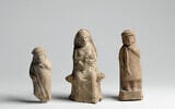 Hellenistic figurines depicting a child, a woman suckling an infant, and a youth (Meidad Suchowolski/Israel Museum)