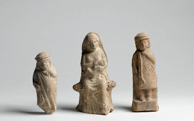 Hellenistic figurines depicting a child, a woman suckling an infant, and a youth (Meidad Suchowolski/Israel Museum)