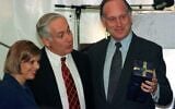 Former US ambassador to Austria Ronald S. Lauder (R) holds a present he received from Israeli Prime Minister Benjamin Netanyahu (L) as Netanyahu's wife Sarah looks on, September 22. Lauder and Netanyahu attended the groundbreaking ceremony at the Lauder Chabad School, which will be built by the Ronald S. Lauder Foundation.