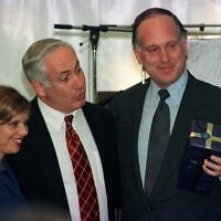 Former US ambassador to Austria Ronald S. Lauder (R) holds a present he received from Israeli Prime Minister Benjamin Netanyahu (L) as Netanyahu's wife Sarah looks on, September 22. Lauder and Netanyahu attended the groundbreaking ceremony at the Lauder Chabad School, which will be built by the Ronald S. Lauder Foundation.