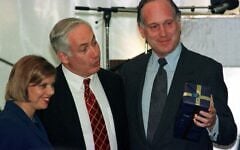 Former US ambassador to Austria Ronald S. Lauder (R) holds a present he received from Israeli Prime Minister Benjamin Netanyahu (L) as Netanyahu's wife Sarah looks on, September 22. Lauder and Netanyahu attended the groundbreaking ceremony at the Lauder Chabad School, which will be built by the Ronald S. Lauder Foundation.