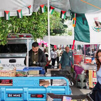 Mohammed Abed, 36, a Palestinian systems engineer who arrived in Mexico in 2025 with 17 family members after losing his daughter in an Israeli airstrike in Gaza, prepares Palestinian food at an open-air market in the Condesa neighbourhood of Mexico City, Mexico, September 22, 2026. (Fred Ramos/Reuters)
