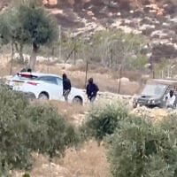 Vehicles at the site where Belgium's foreign minister says masked settlers attacked Western diplomats and officials near Taybeh, in the West Bank, on October 17, 2026. (Emad Diab/via REUTERS)