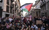 Protesters, including peo-Palestinians, clash with police during a demonstration against the rising cost of living and in support of better living conditions, on October 17, 2026 in Milan, Italy. (Stringer/Anadolu via Reuters)