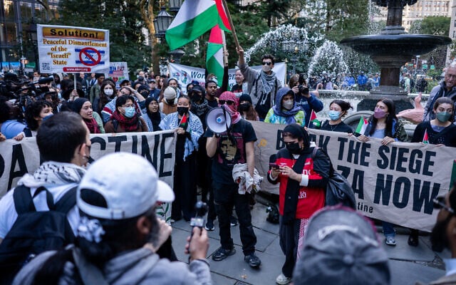 Anti-Zionist protesters outside New York City Hall, October 7, 2026. (Luke Tress/Times of Israel)