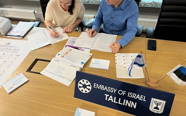 Officials prepare voting materials at the Israeli embassy in Tallinn, Estonia, as voting gets underway for Israel’s 26th Knesset elections, October 15, 2026. (Foreign Ministry)