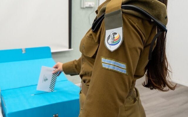 An IDF soldier votes in Israel's national elections at a General Staff Supply Center base, October 27, 2026. (Israel Defense Forces) An IDF soldier votes in Israel's national elections at a General Staff Supply Center base, October 27, 2026. (Israel Defense Forces)