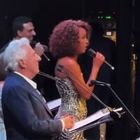 Dustin Hoffman (left) joins Israeli singer Ester Rada for Israel’s national anthem, “Hatikvah,” at a special evening of solidarity with Israel at UCLA in Los Angeles, October 21, 2026. (Screenshot/ 
@erevtov2/Israelim via X)