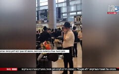 Footage posted to social media shows Haredi passengers dancing at Ben Gurion International Airport, where 42 ultra-Orthodox men were arrested in a Military Police operation upon their return to Israel from the United States, October 20, 2026. (Screenshot/Social media: used in accordance with Clause 27a of the Copyright Law via Ch12);